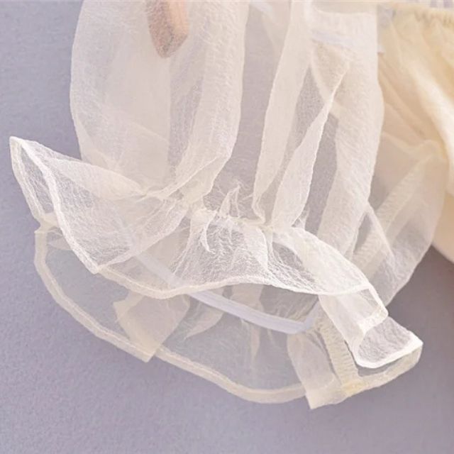 Transparent organza blouse with ruffled sleeves