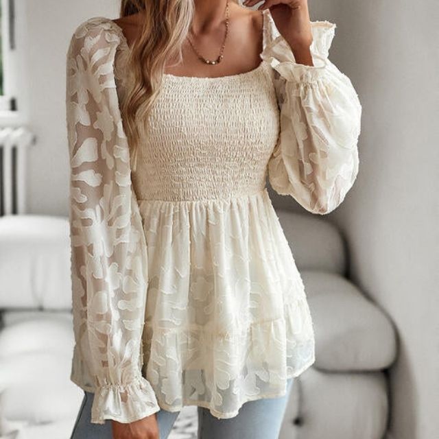 Ruffled blouse with a square neckline and sheer sleeves