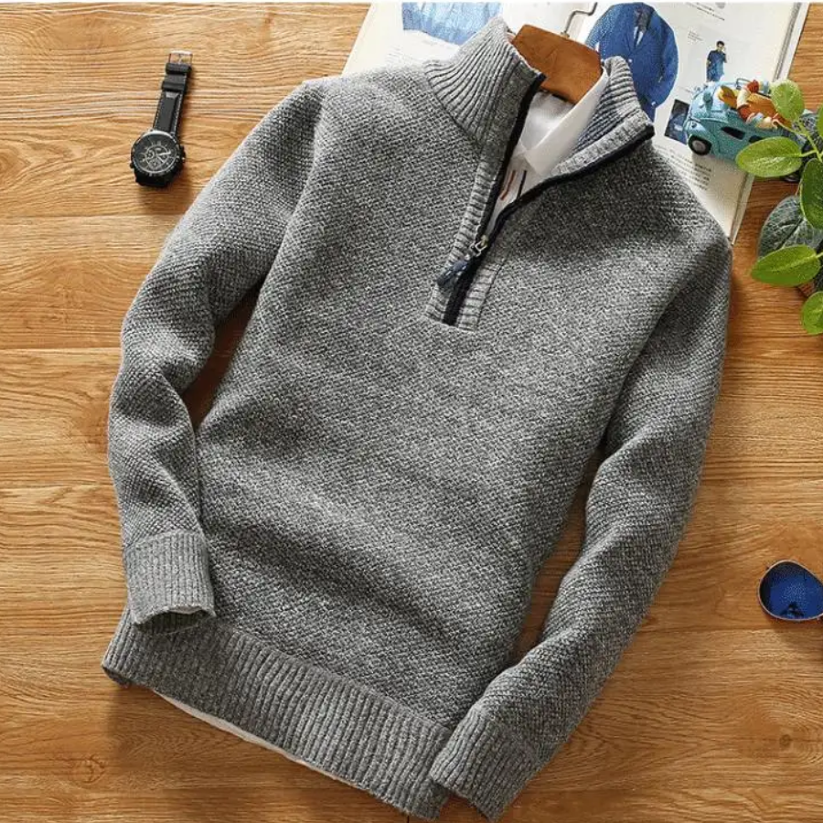 Warming knitted pullover with stand-up collar and zip fastening