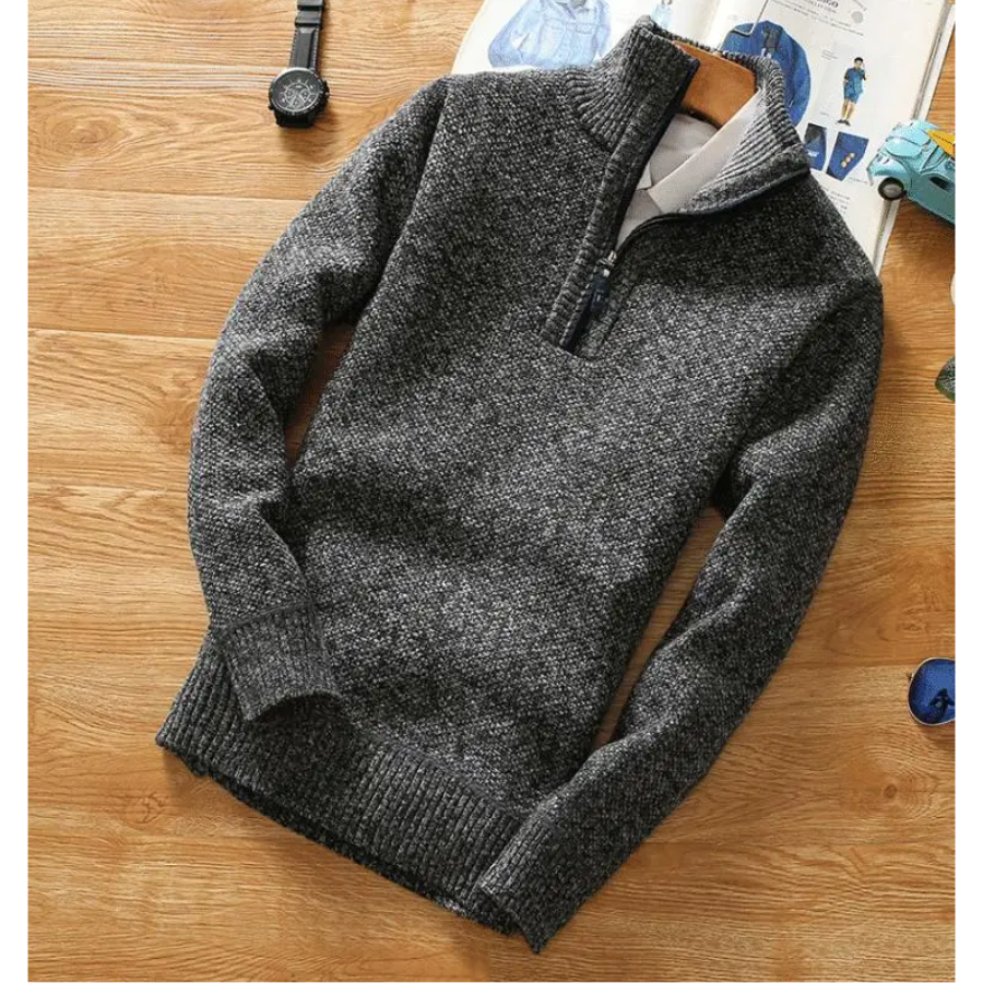 Warming knitted pullover with stand-up collar and zip fastening