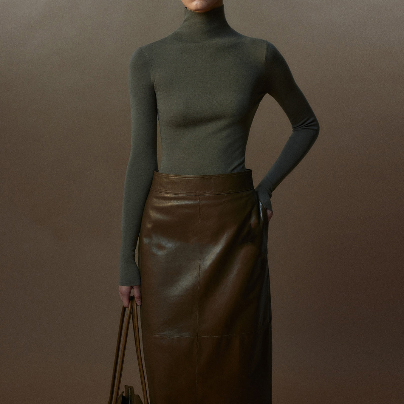 Plain-coloured long-sleeved knitted top with high neckline