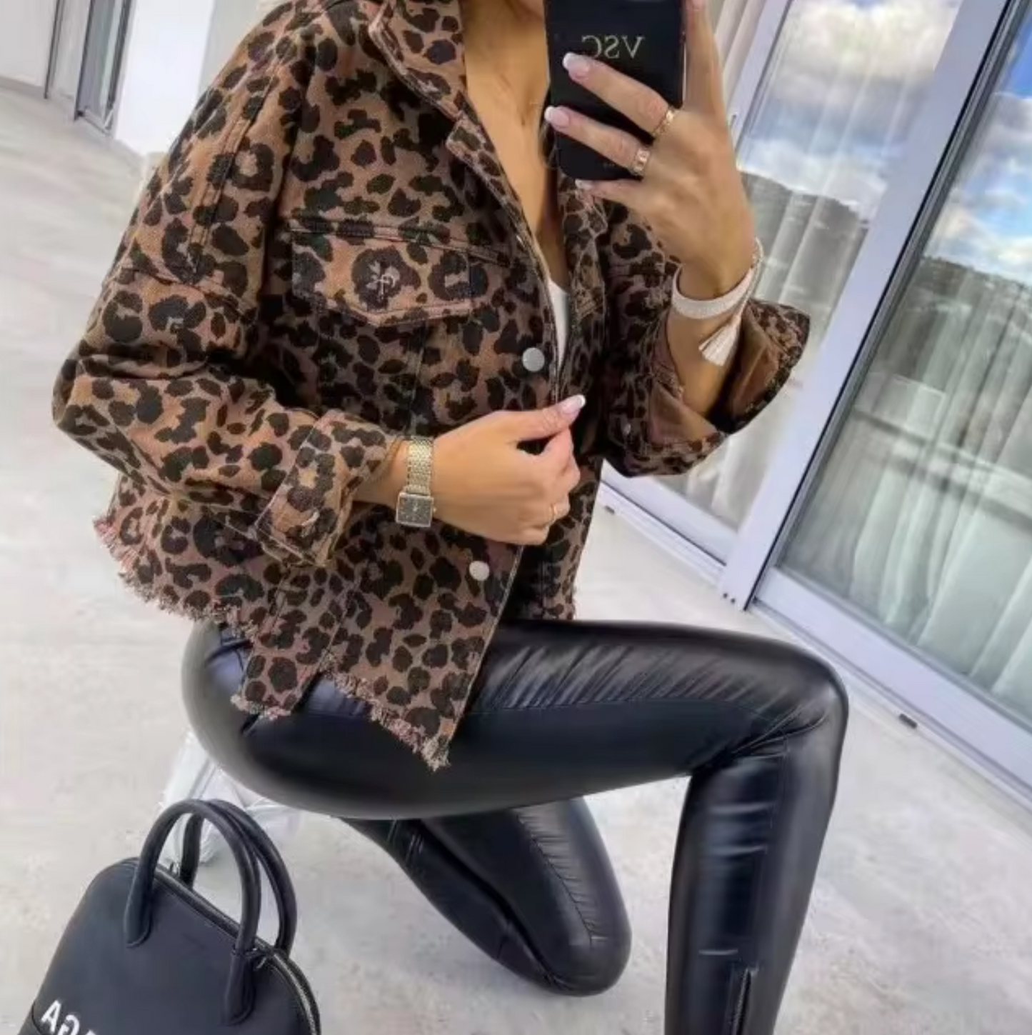 Denim jacket with leopard print