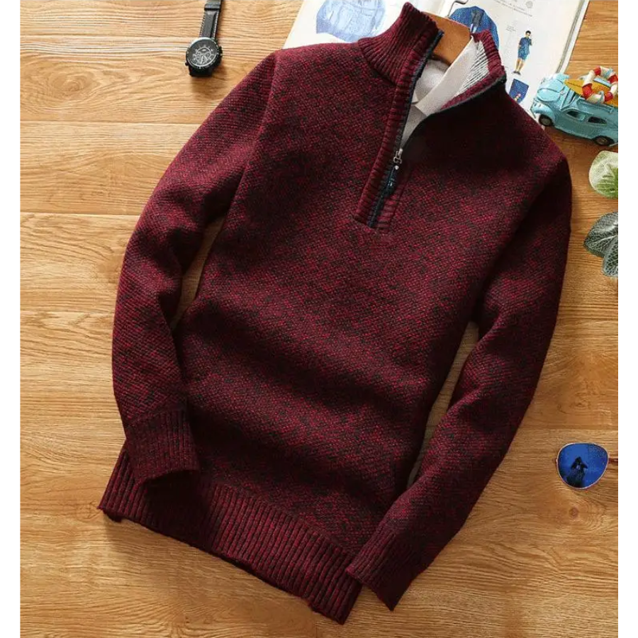 Warming knitted pullover with stand-up collar and zip fastening