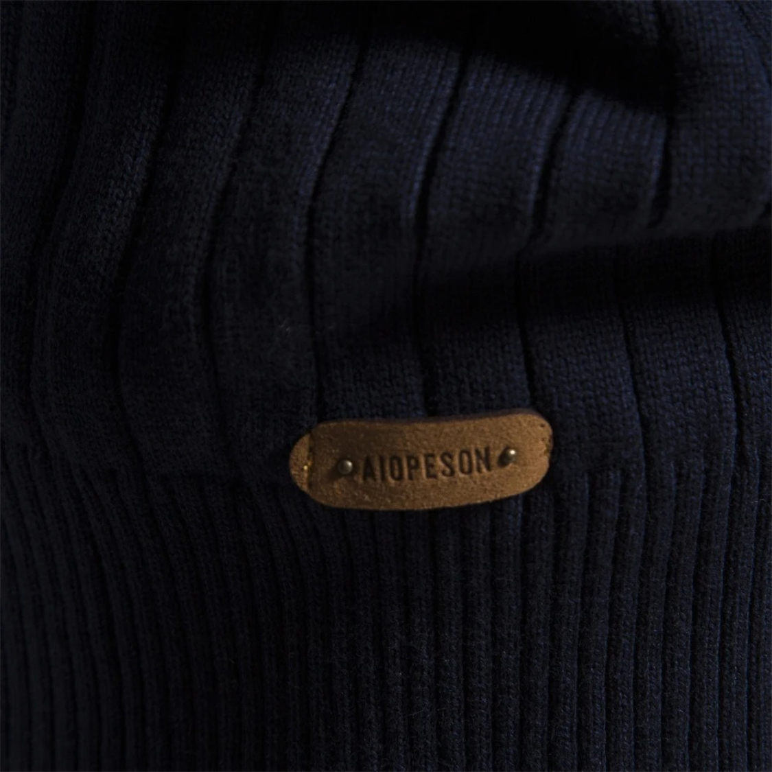 Ribbed knitted pullover with zip and stand-up collar