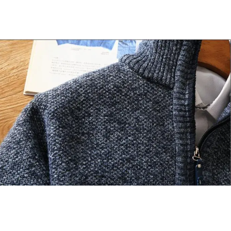 Warming knitted pullover with stand-up collar and zip fastening