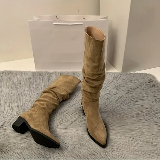 Sturdy, pointed boots up to mid-calf