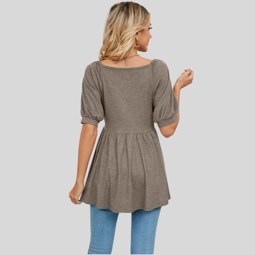 Wide flared peplum top with V-neckline