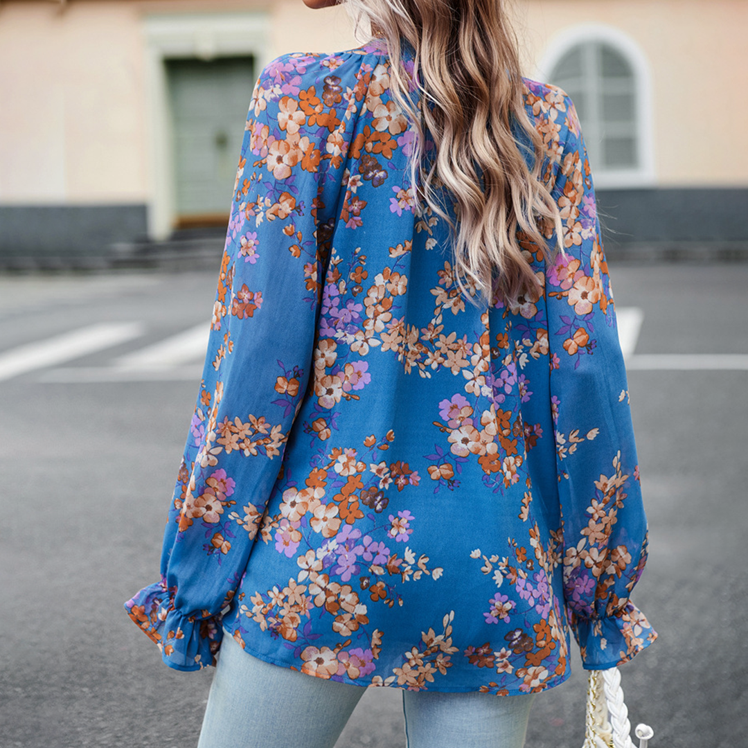 Floral blouse with V-neck and puff sleeves