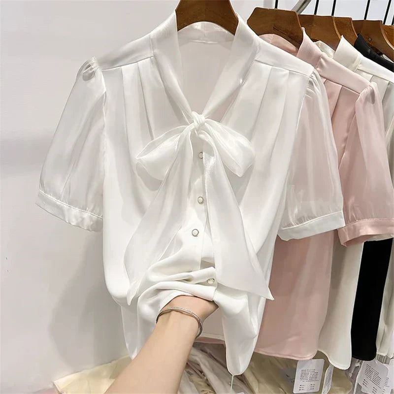 Blouse with bow and lacing