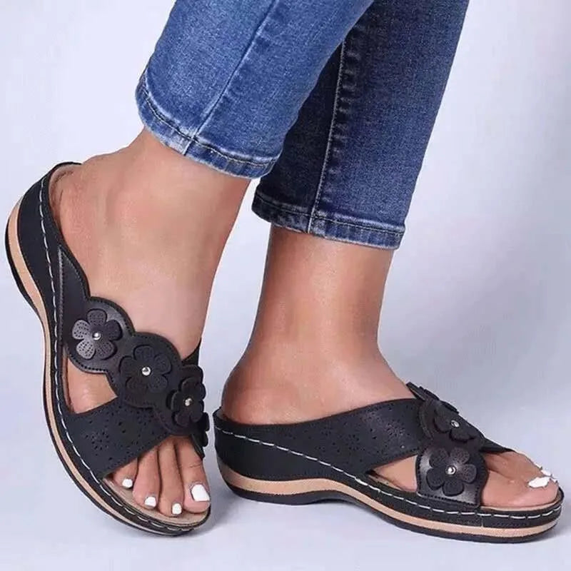 Roman sandals for women with floral embellishment and wedge heel