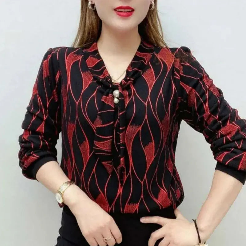 Wave pattern V-neck blouse with pearl embellishment