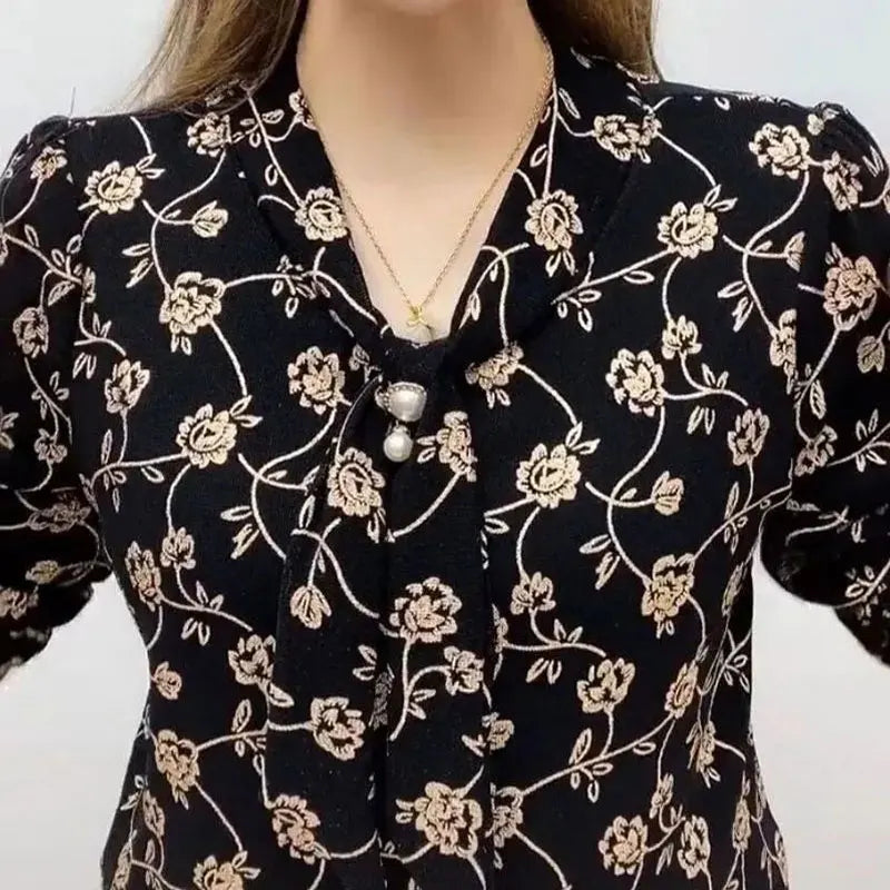 Wave pattern V-neck blouse with pearl embellishment