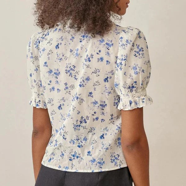 Vintage blouse with floral pattern and lace hem