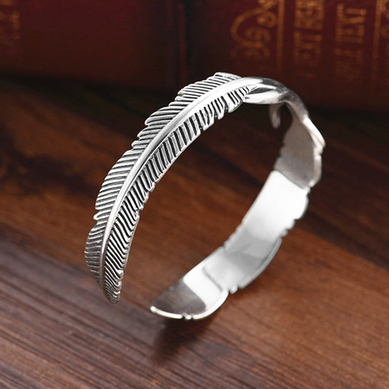 Sterling feather cuff bracelet with openwork design