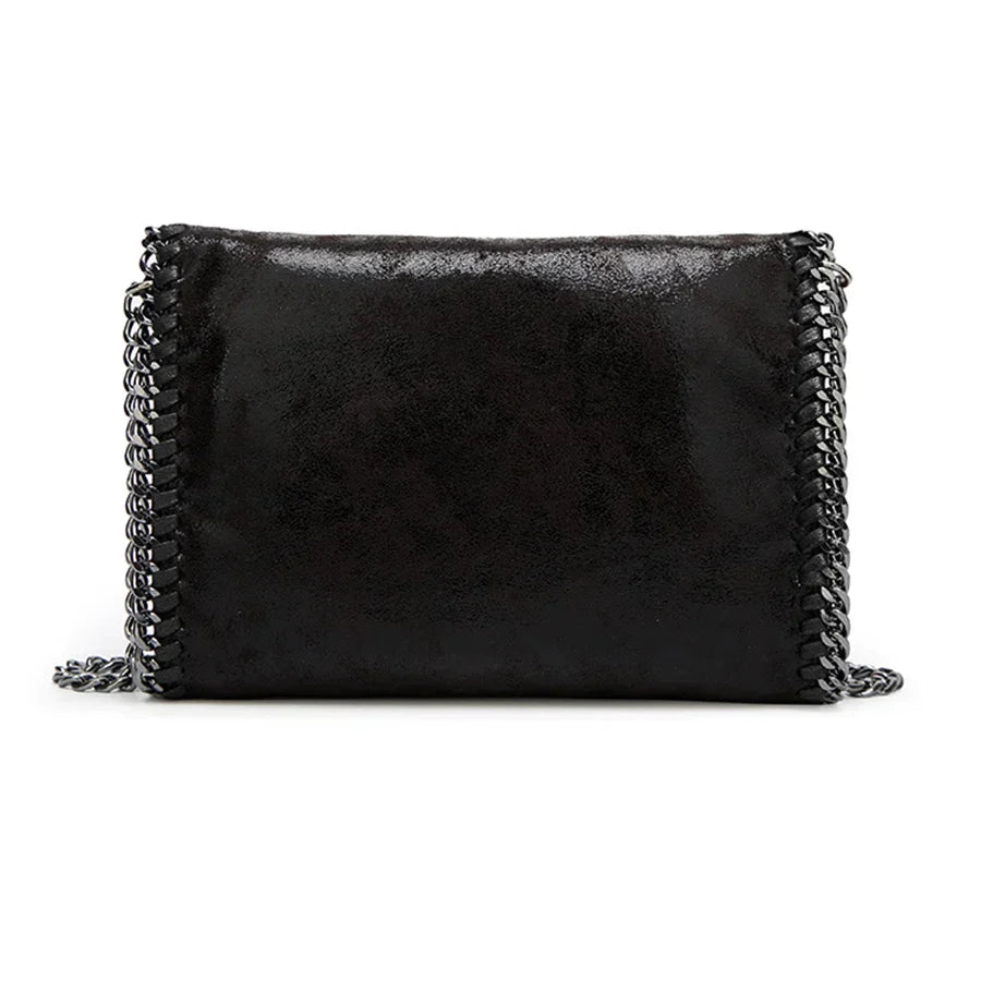 Suede clutch with chain embellishment