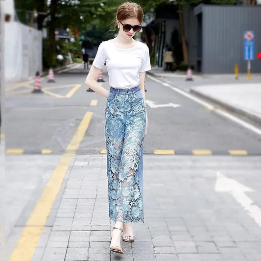 High-waisted jeans with lace patchwork