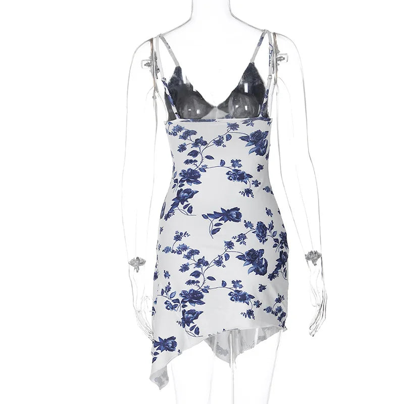 Asymmetric slip dress with lace inserts and floral accents