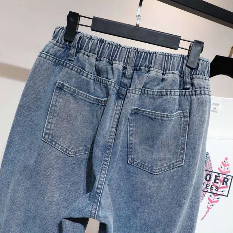 High-waisted ankle-length harem jeans with elasticated waistband