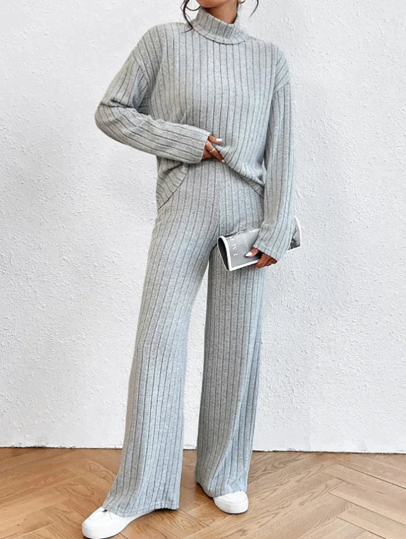 Knitted trousers and sweater with turtleneck for women