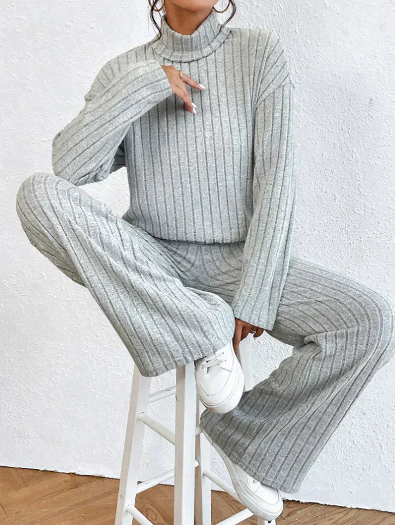 Knitted trousers and sweater with turtleneck for women