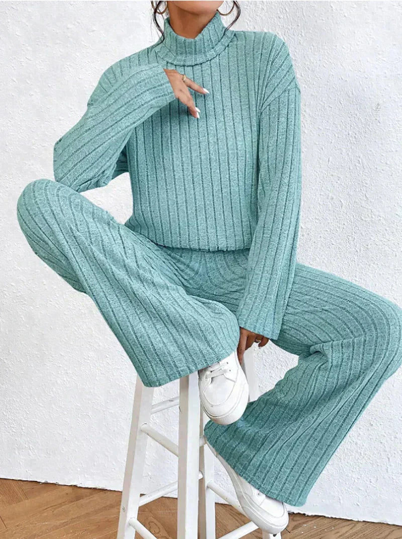 Knitted trousers and sweater with turtleneck for women