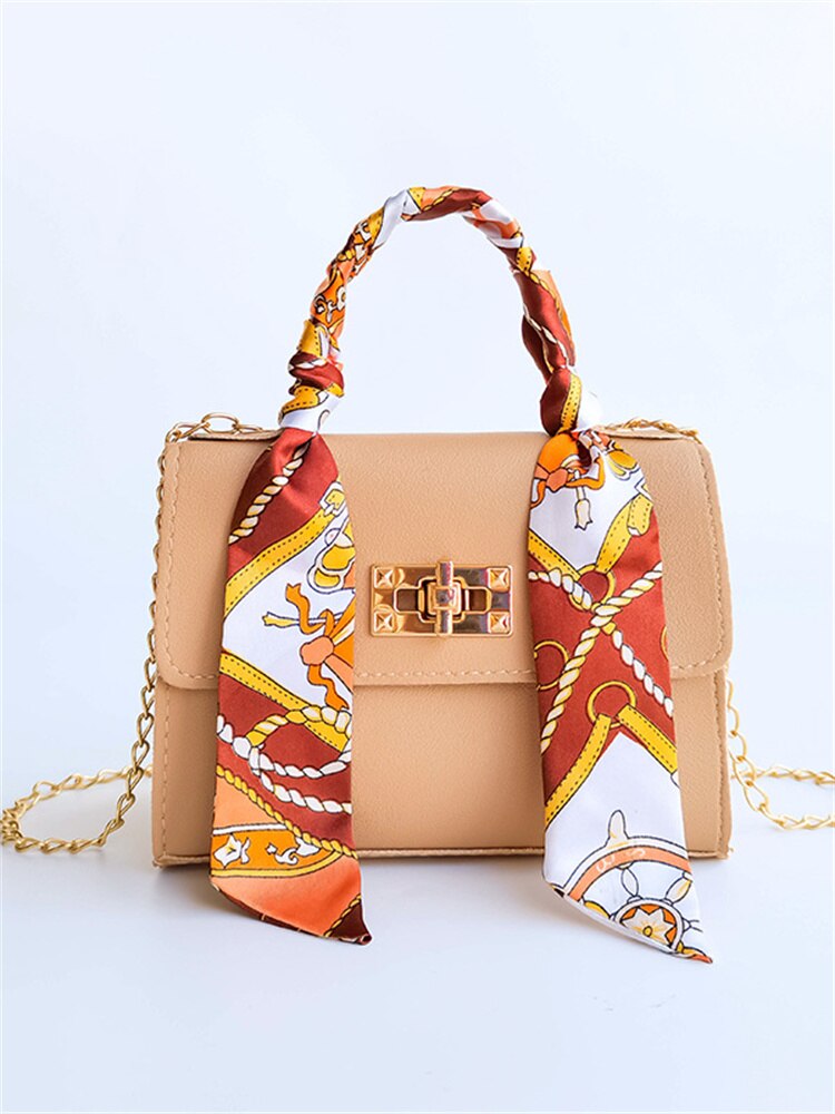 Elegant leather shoulder bag with bandana detail