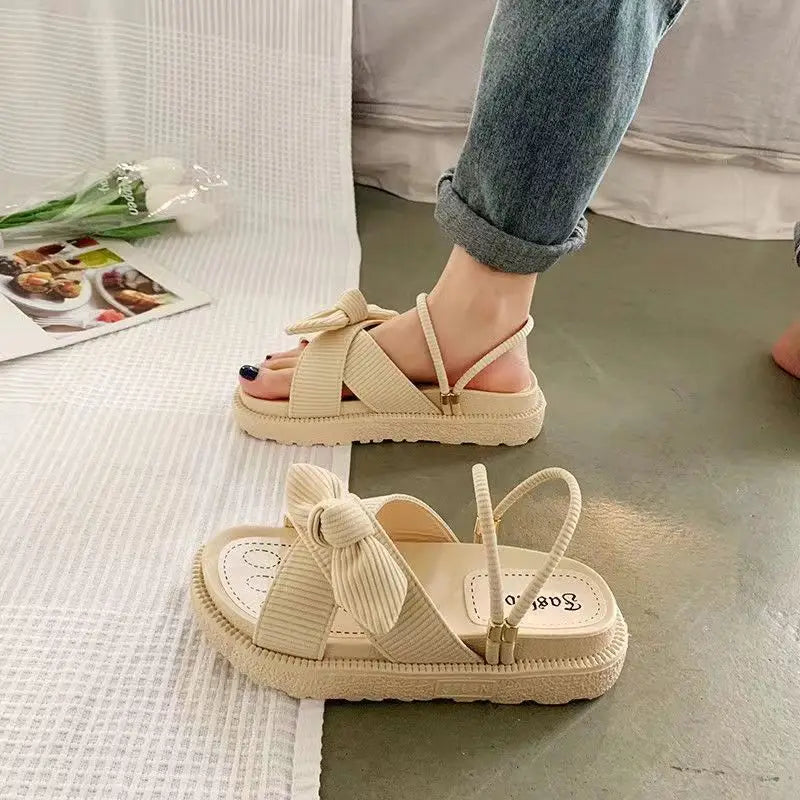 Women's flip-flops with butterfly knot in Roman style with thick soles