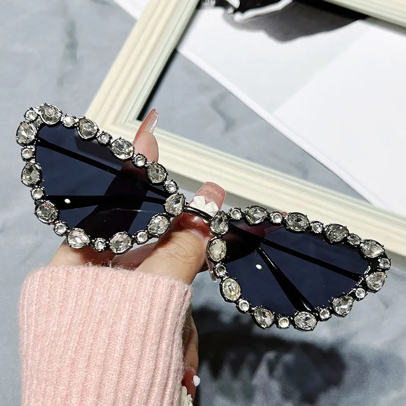 Heart-shaped sunglasses with gemstone embellishments