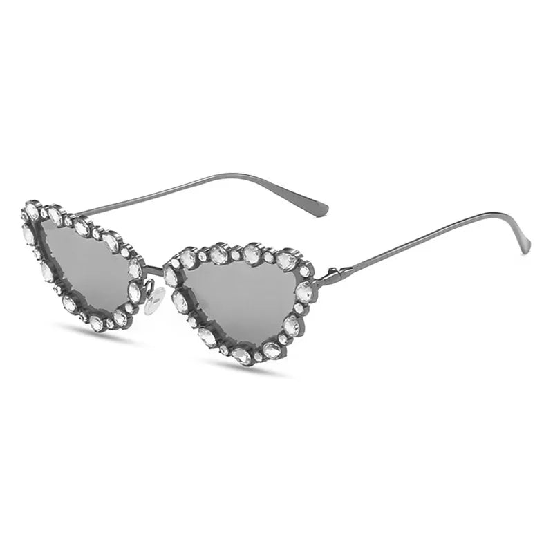 Heart-shaped sunglasses with gemstone embellishments