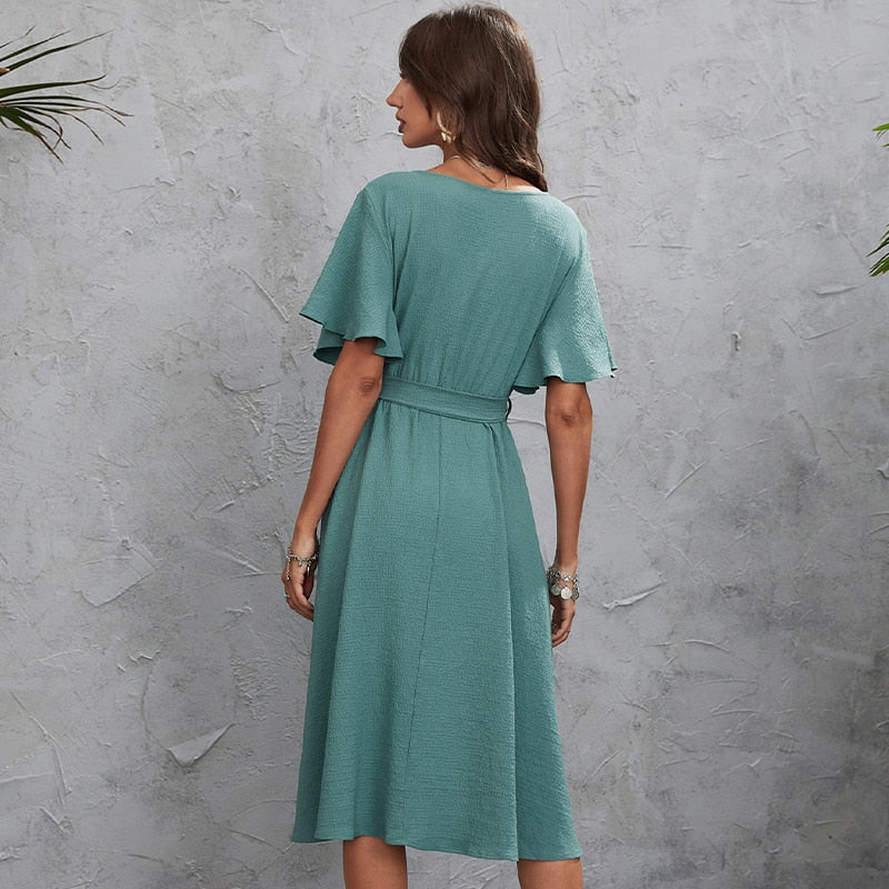 Wrap dress with V-neckline and flared sleeves