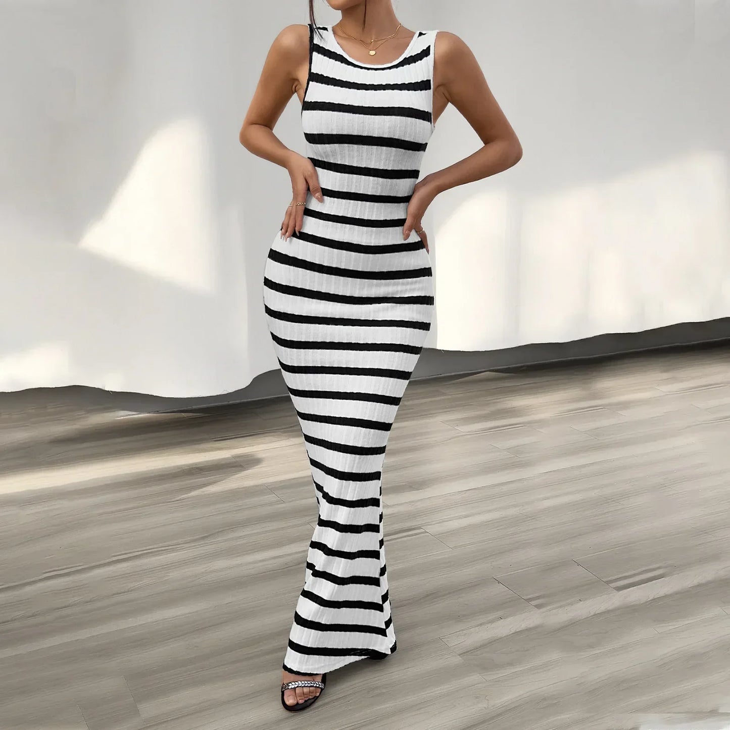 Sleeveless striped maxi dress with flared hem