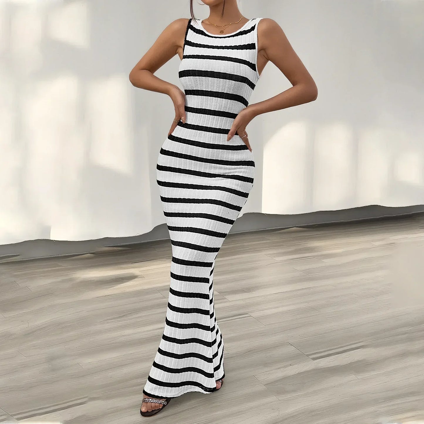 Sleeveless striped maxi dress with flared hem