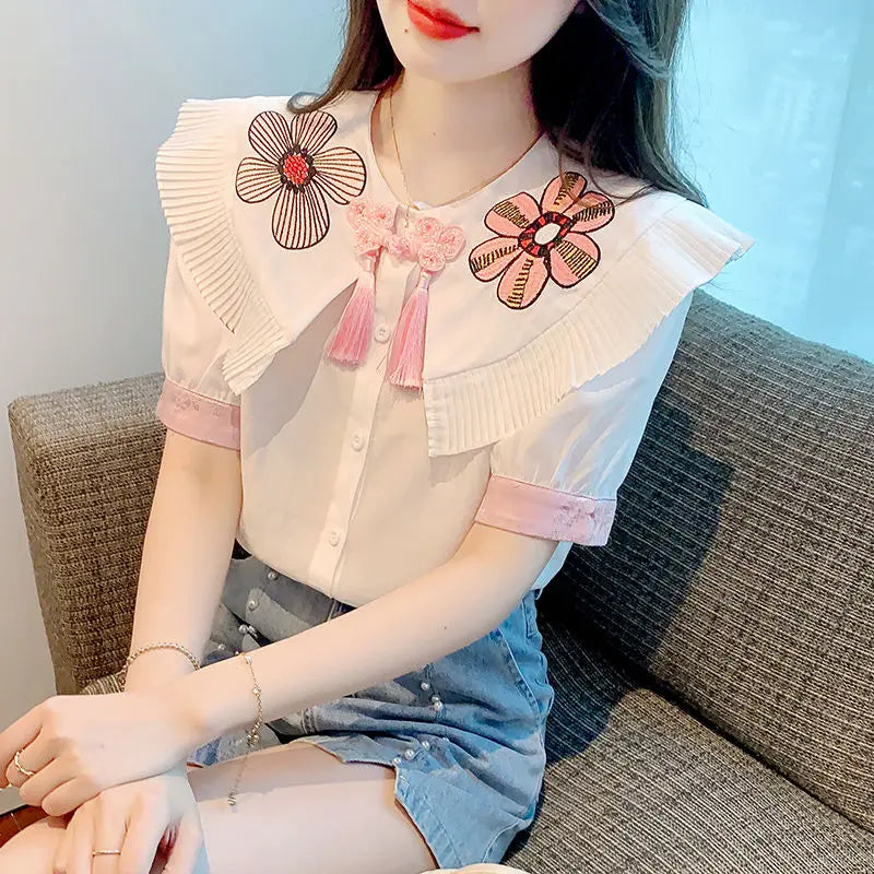 Fashionable summer blouse with embroidery and short sleeves