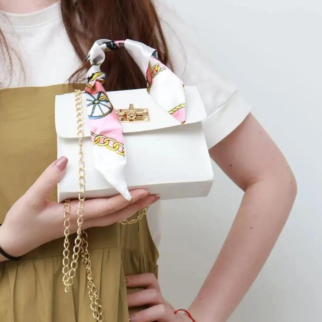 Classic handbag with silk scarf and chain detail