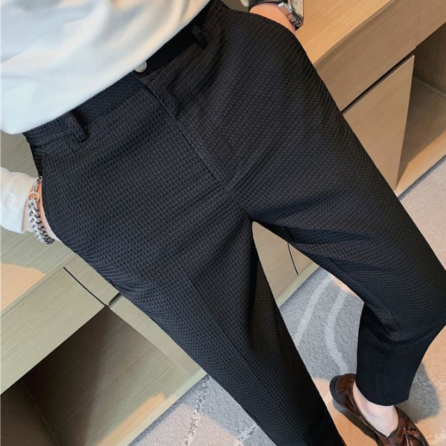 Slim-fit trousers with a subtle checked pattern