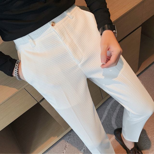 Slim-fit trousers with a subtle checked pattern