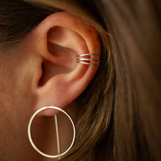 Spiral ear cuff with shiny surface