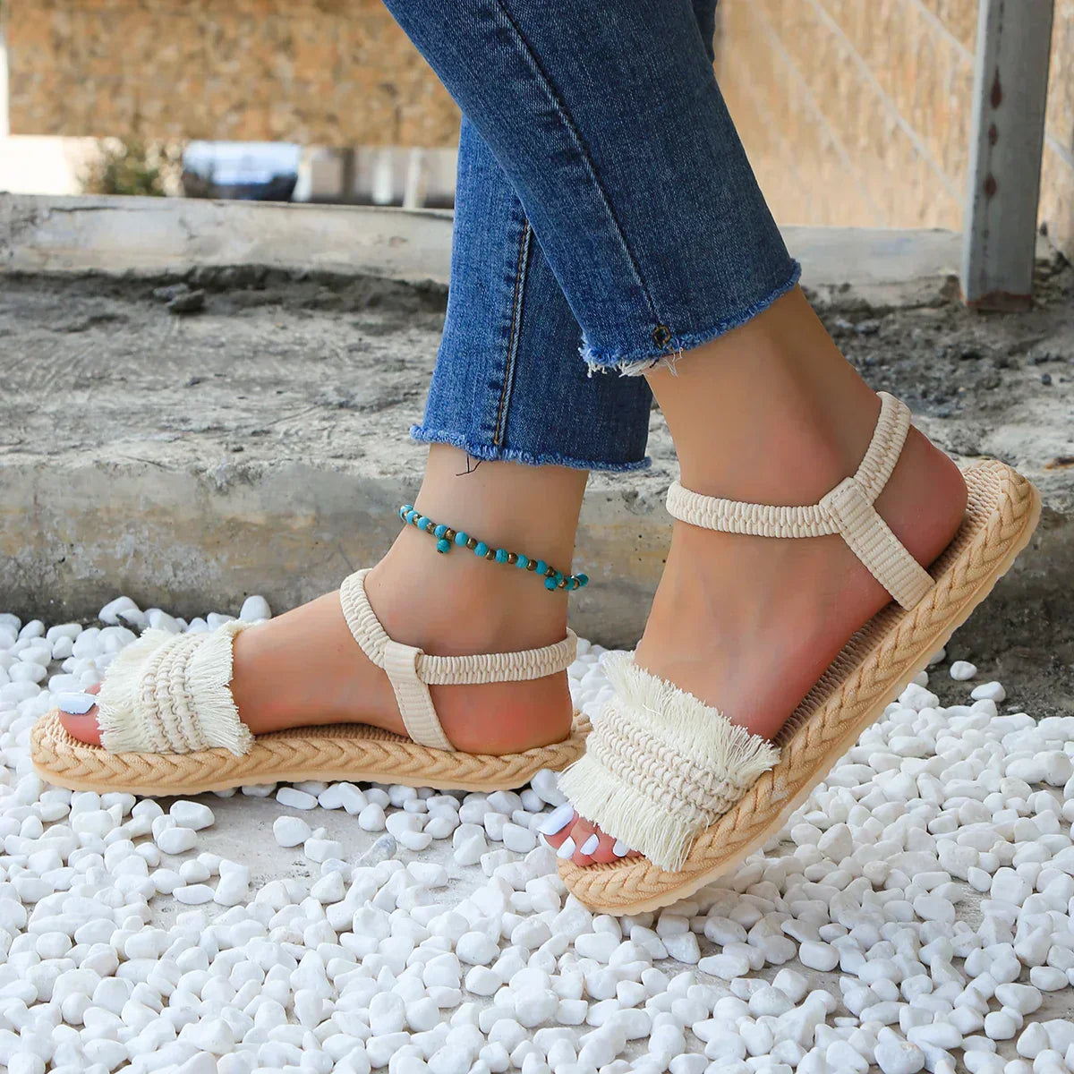 Sandals with tassels and flat heel