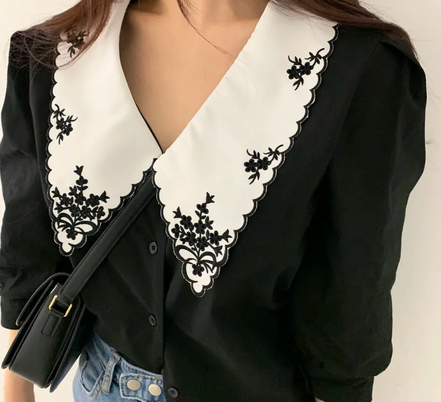 Lace blouse with floral embroidery