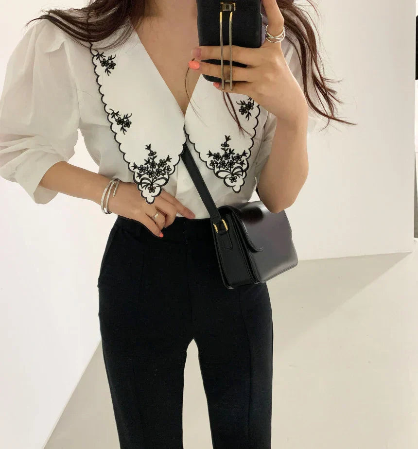 Lace blouse with floral embroidery