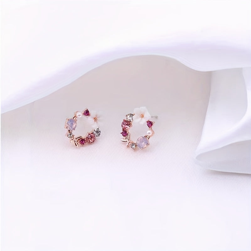 Stud earrings with floral motif and gemstone accents