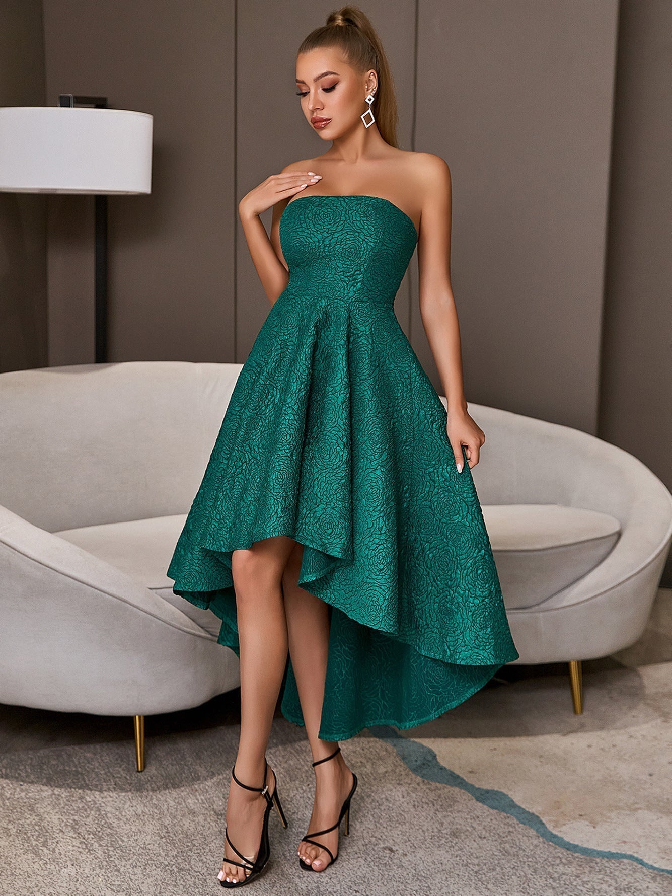 Green sleeveless elegant flared party dress with bare upper body