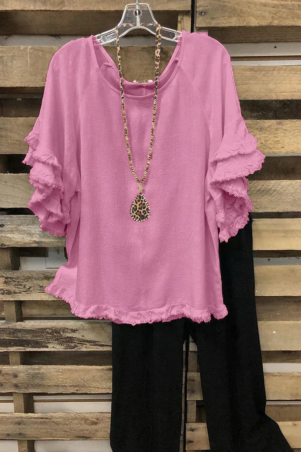 Ruffled cotton blouse with round neckline