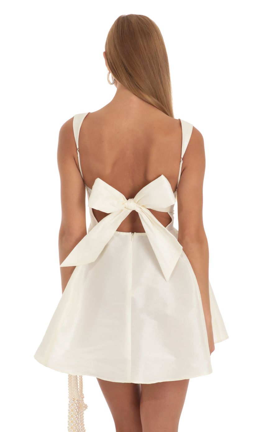 Mini dress with bow and flare