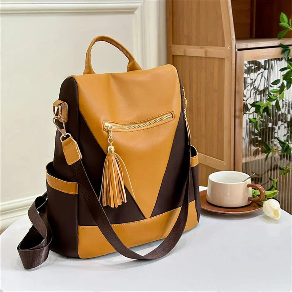 Backpack in two-colour look with tassel pendant