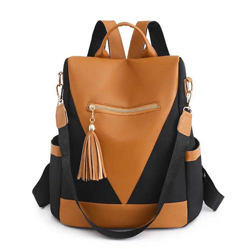 Backpack in two-colour look with tassel pendant