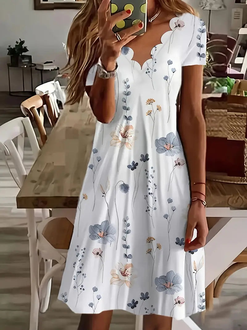 Dress with floral pattern and shell trim