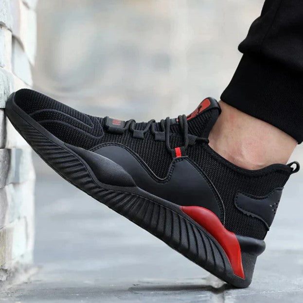 Sporty black trainers with red accents