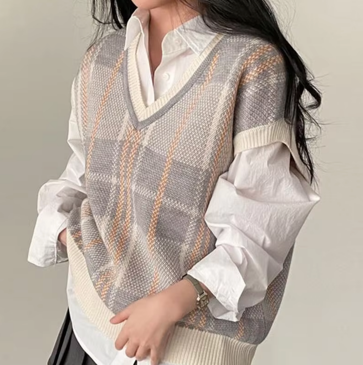 Knitted sleeveless cardigan with V-neck