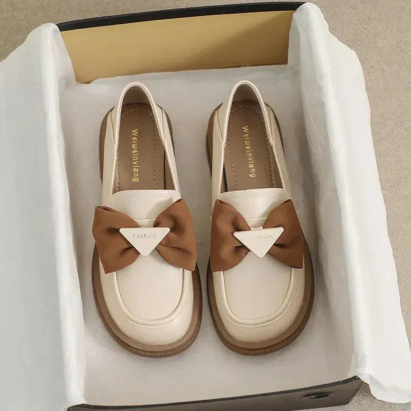 Elegant slip-on shoes with bow accent